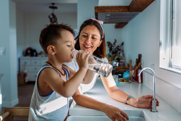 A mother and child at the sink